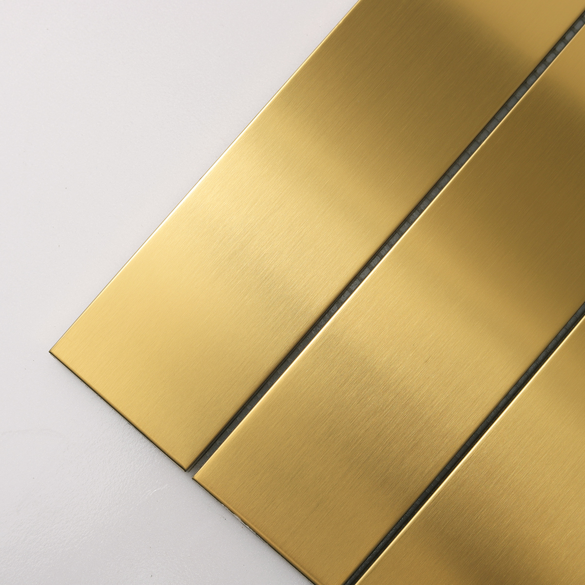 Detailed view of Large Rectangle Gold Brushed Metal Mosaic Tiles, showing brushed metal surface