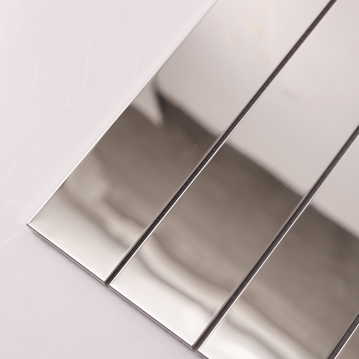 Detailed view of Mirrored Rectangle Strip Metal Silver Mosaic Tiles, showing reflective surface