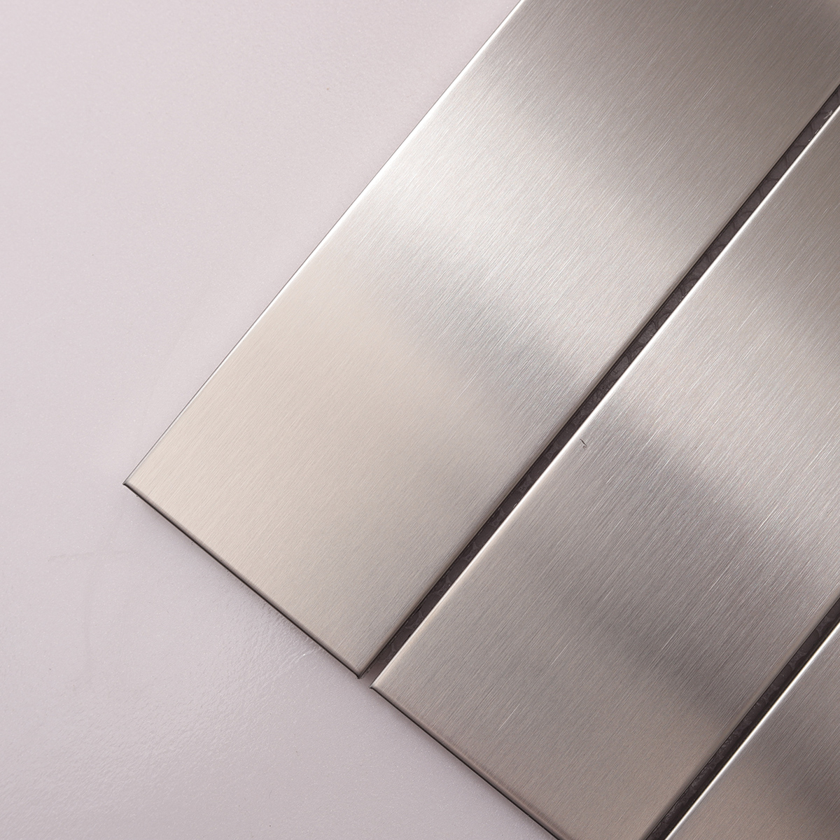 Close-up of Stacked Brick Silver Brushed Stainless Steel Mosaic Tile, texture detail