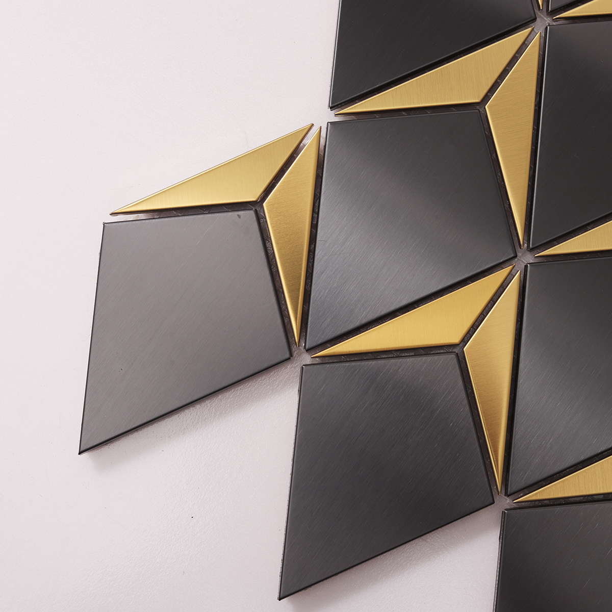 Close-up of Black and Gold Diamond Metal Mosaic Tile, texture detail, glossy surface