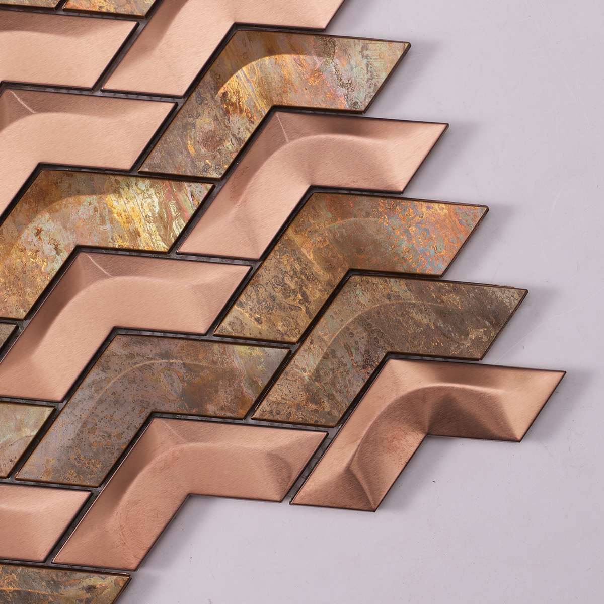 Close-up of Copper and Stainless Steel Chevron 3D Metal Mosaic Tile, intricate texture