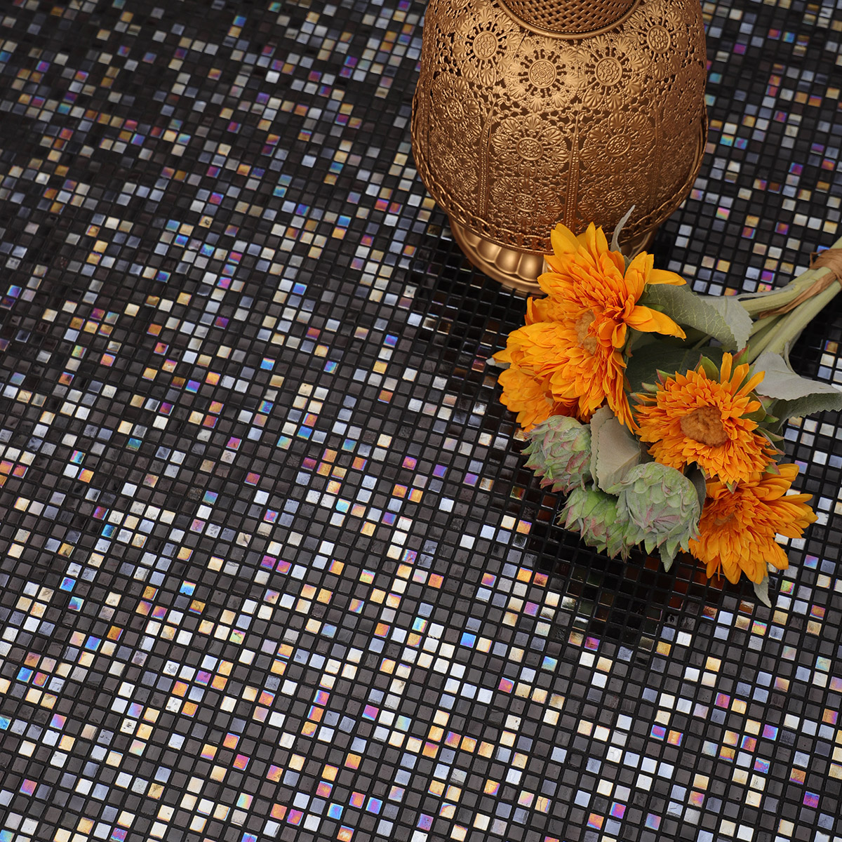 Mini Black Square Iridescent Glass Mosaic Tiles on the floor, adorned with a flower bouquet.