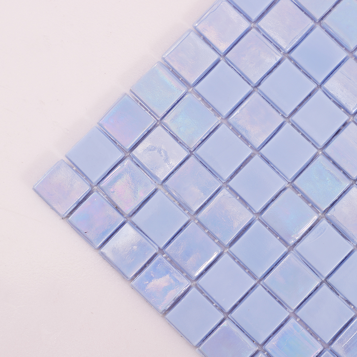 Close-up of Ocean Blue Iridescent Glass Mosaic Pool Tile, showcasing smooth and shiny surface