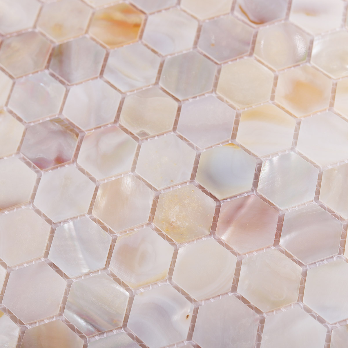 Detailed view of Natural Mother of Pearl Hexagon Mosaic Tiles, showcasing iridescent surface.