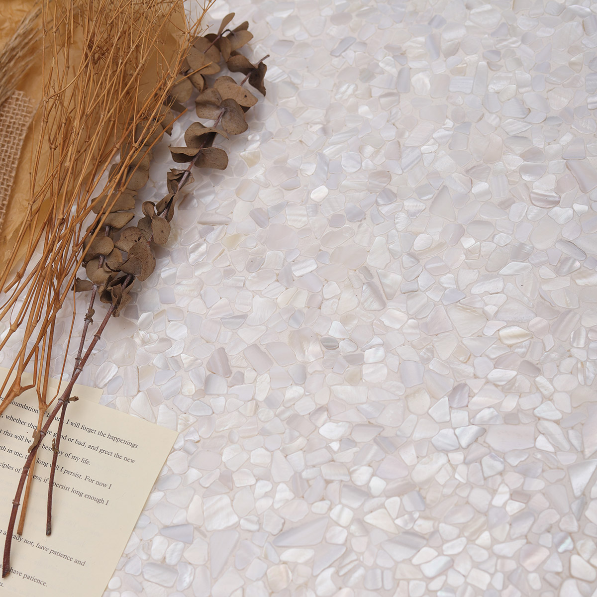 White Mother of Pearl Pebbles Mosaic Tiles on the floor, creating an elegant and polished look