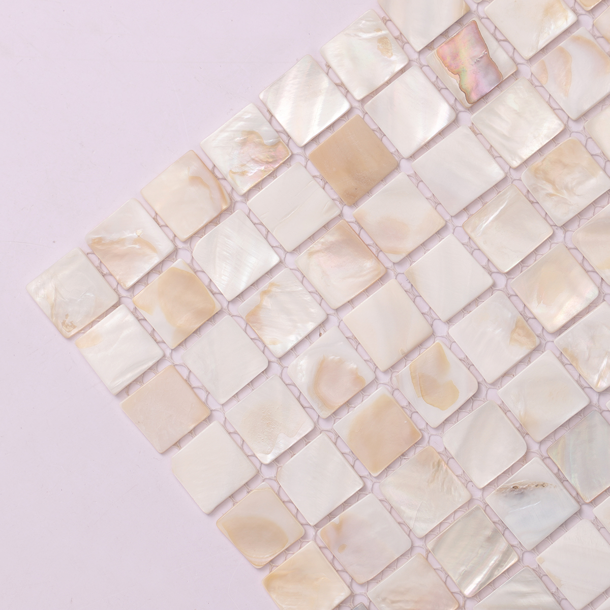 Close-up of Seashell Mother of Pearl Square Mosaic Tiles, highlighting smooth texture