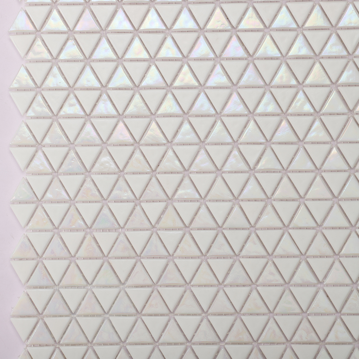 Close-up of Glossy Iridescent White Glass Triangle Mosaic Tile