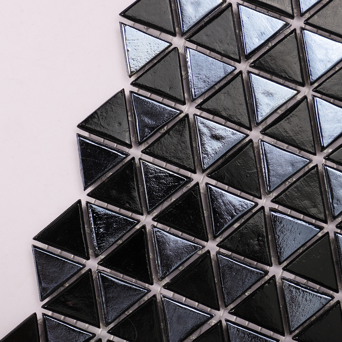 Side view close-up of Glossy Mini Triangle Black Glass Mosaic Tile