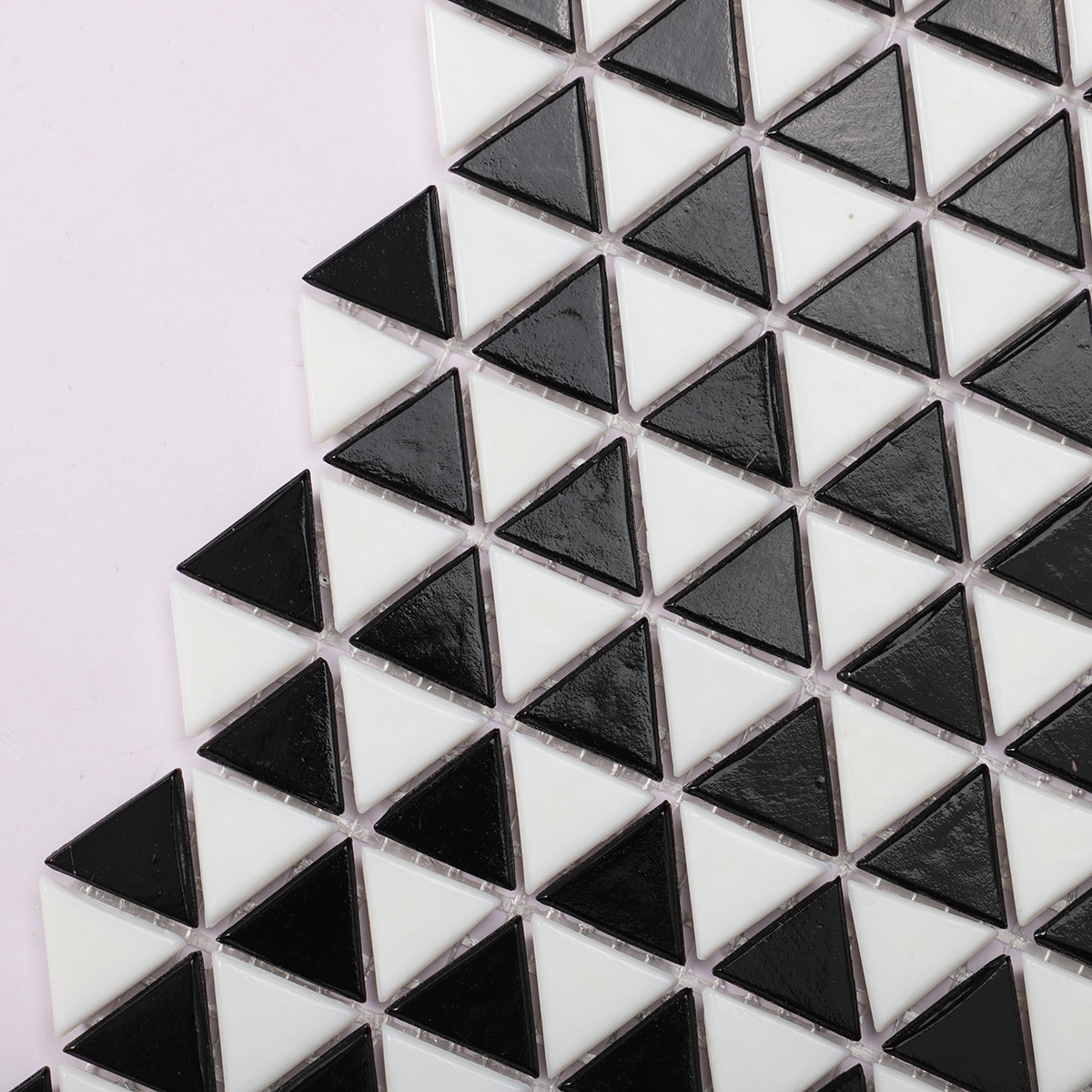 Side view close-up of Black and White Triangle Shaped Glass Mosaic Tile