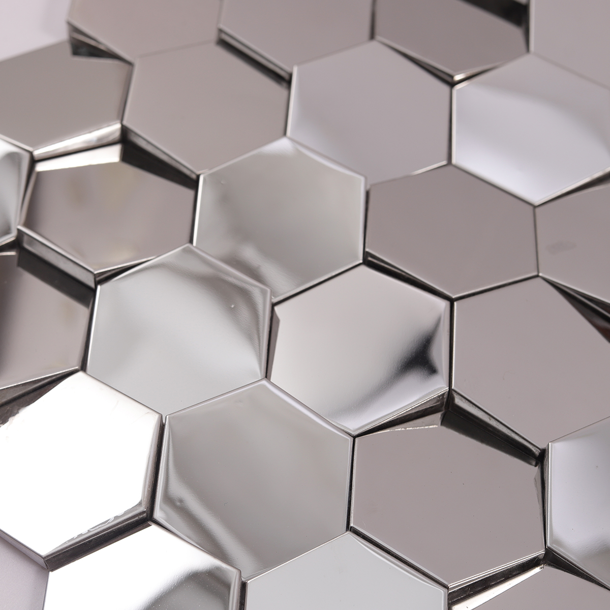 Close-up of Hexagon 3D Silver Stainless Steel Mirror Tile Surface