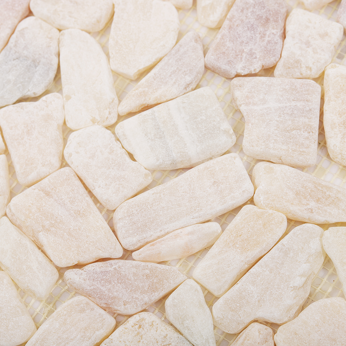 Detailed View of Honed Travertine Pebble Mosaic Tile Texture