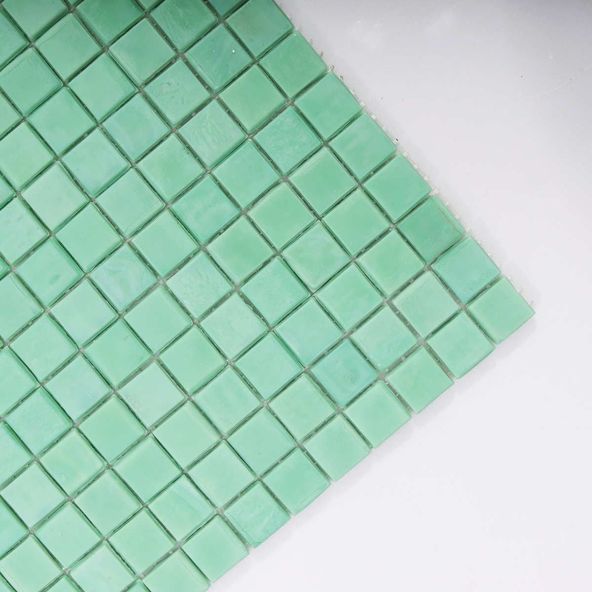 Close-up of Mint Green Glass Mosaic Tile Surface