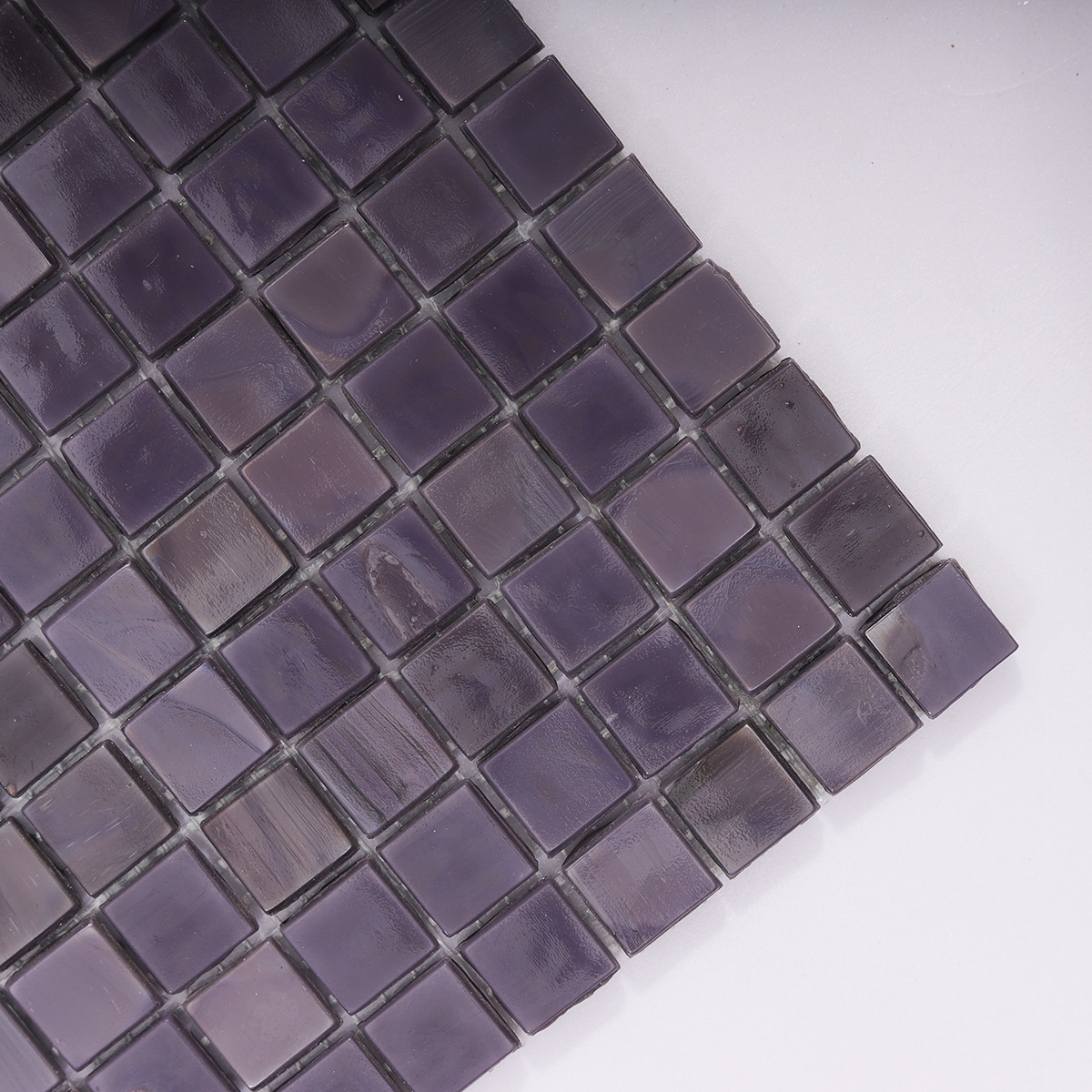 Close-up of the rich dark purple glass finish, highlighting texture and color depth