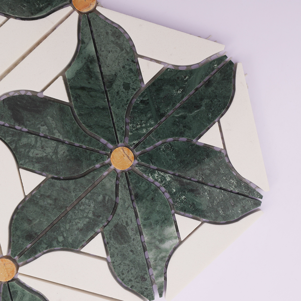 Zoomed-in image showing the intricate pattern of green and white marble flower mosaic tiles