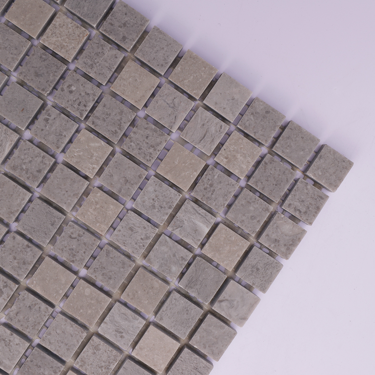  Zoomed-in view highlighting the texture and finish of the gray polished marble tiles.