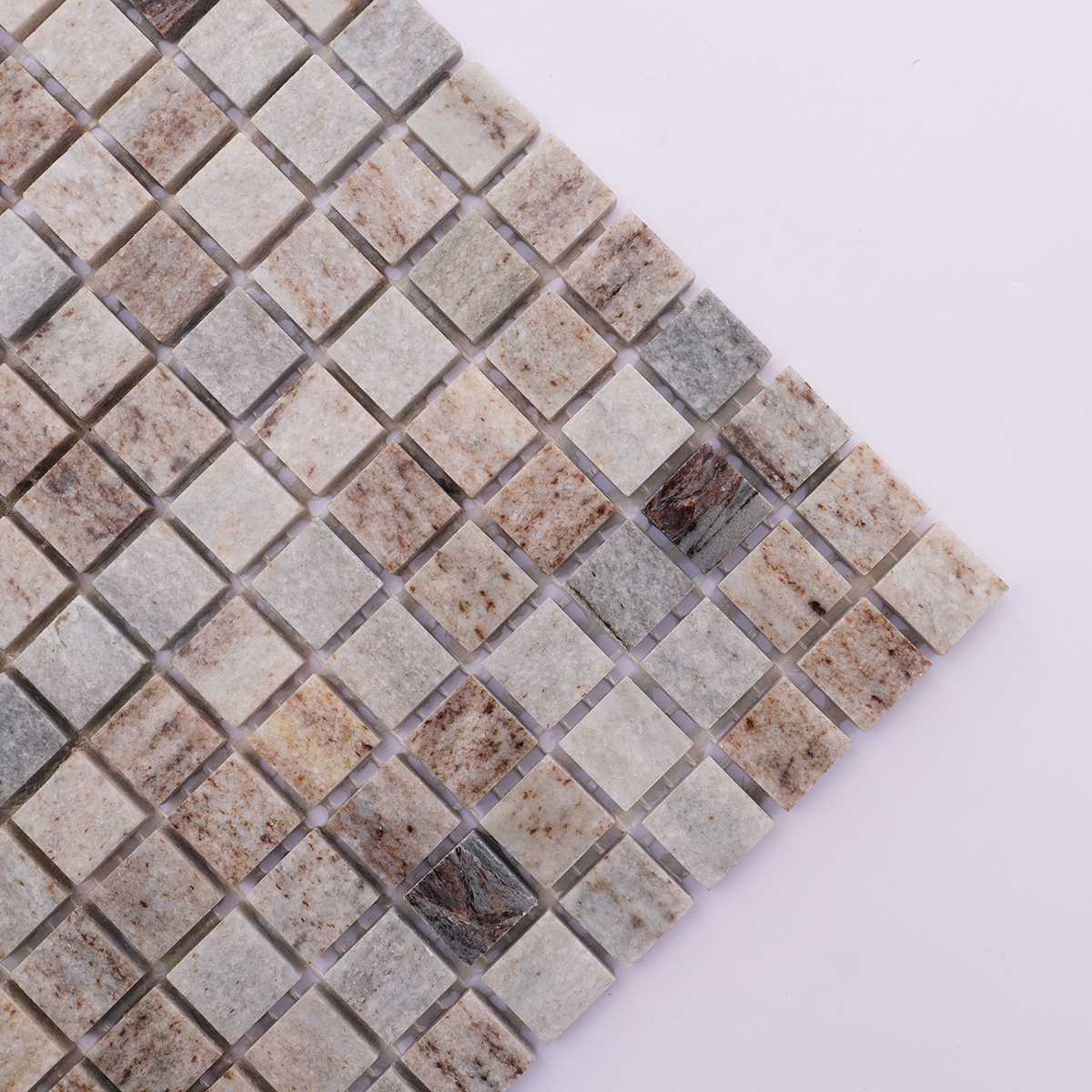 Close-up view of the texture and finish of gray wooden honed marble tiles.