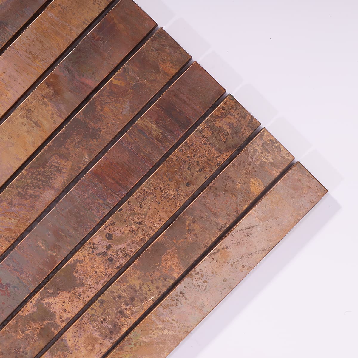 Vintage copper mosaic tile close-up on corner layout