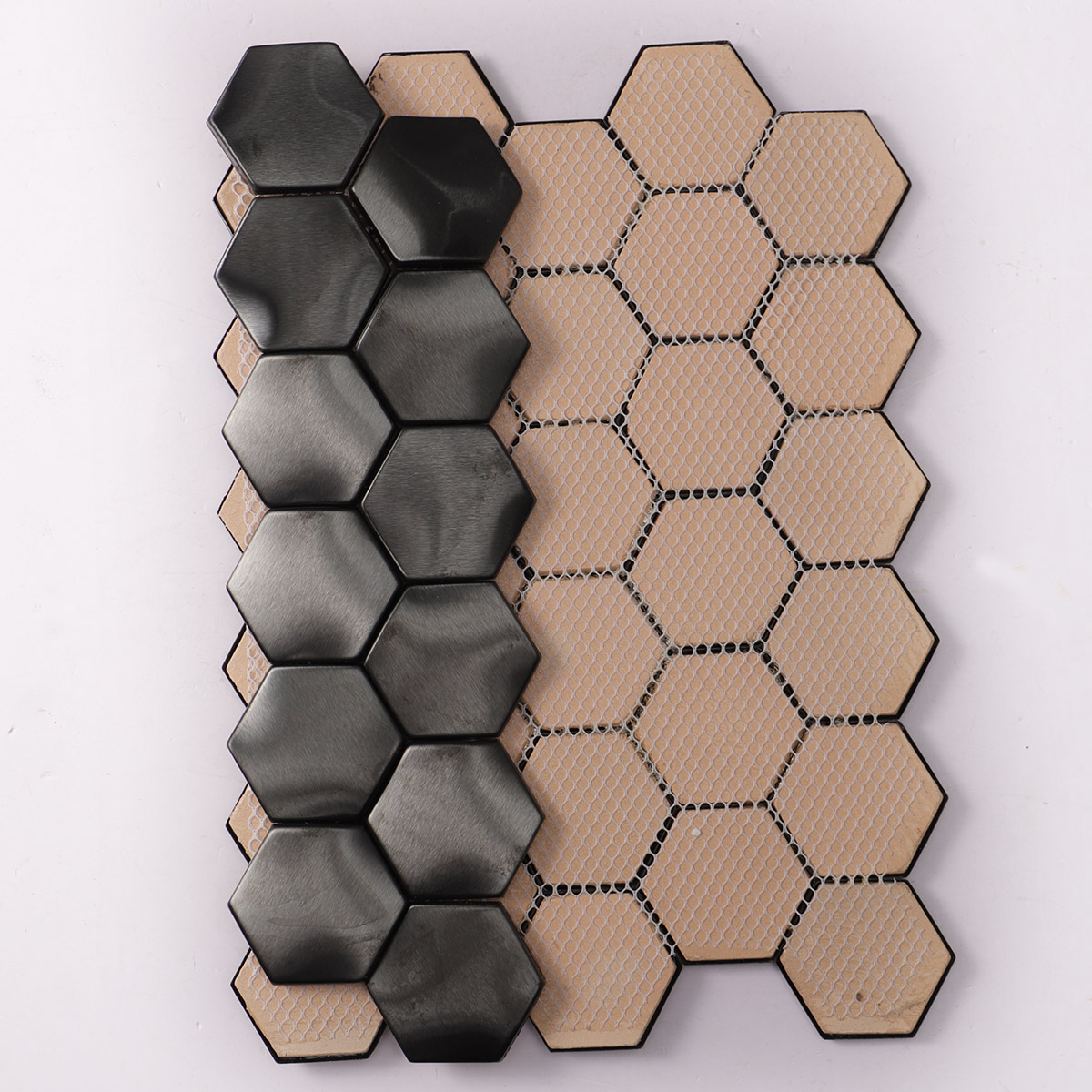 Back side of wavy 3D metal black brushed stainless steel hexagon mosaic tiles, folded.