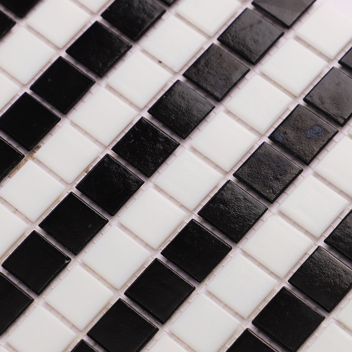 Close-up of black and white stripe vintage glass mosaic tiles.

