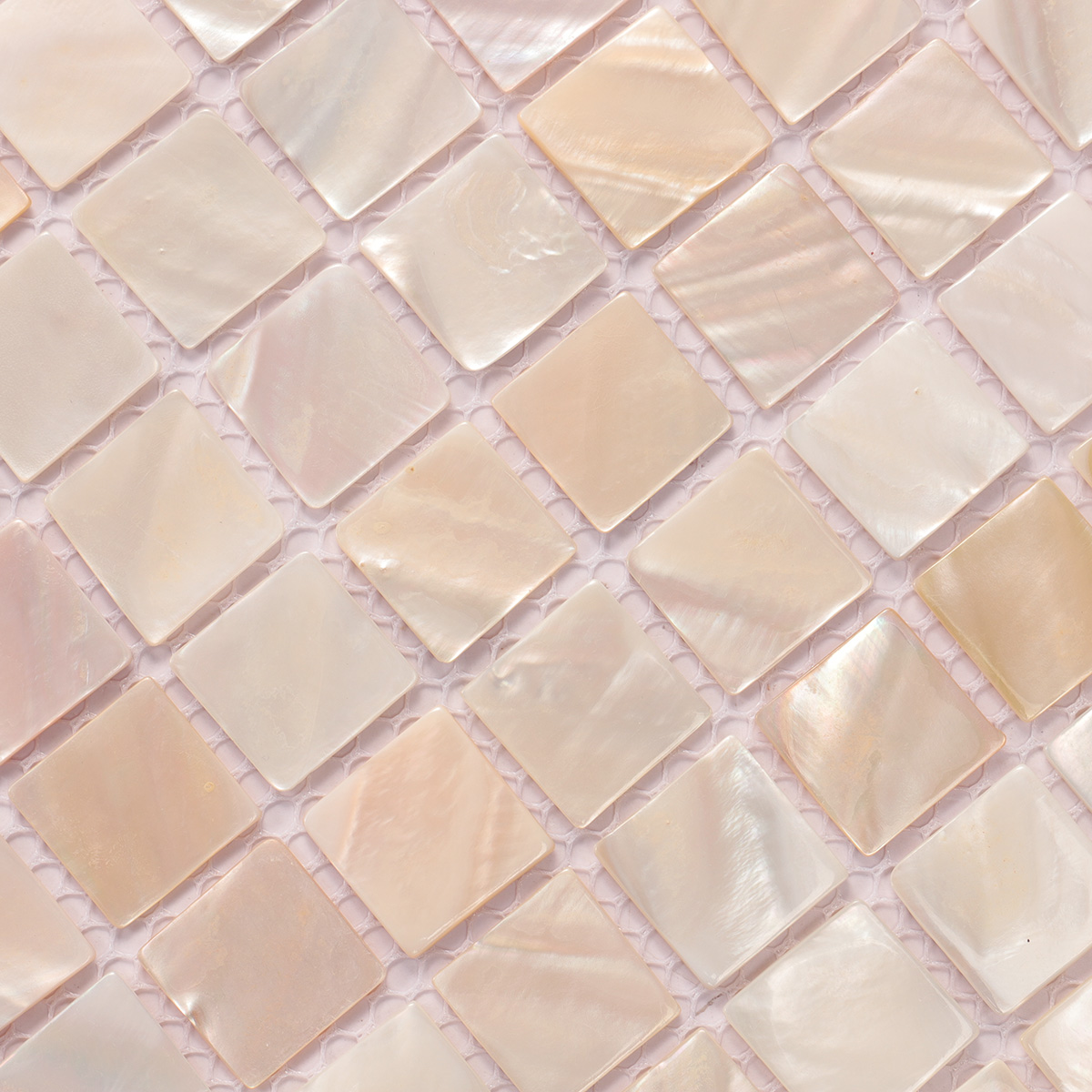 Second close-up of beige iridescent mother of pearl square mosaic tile.