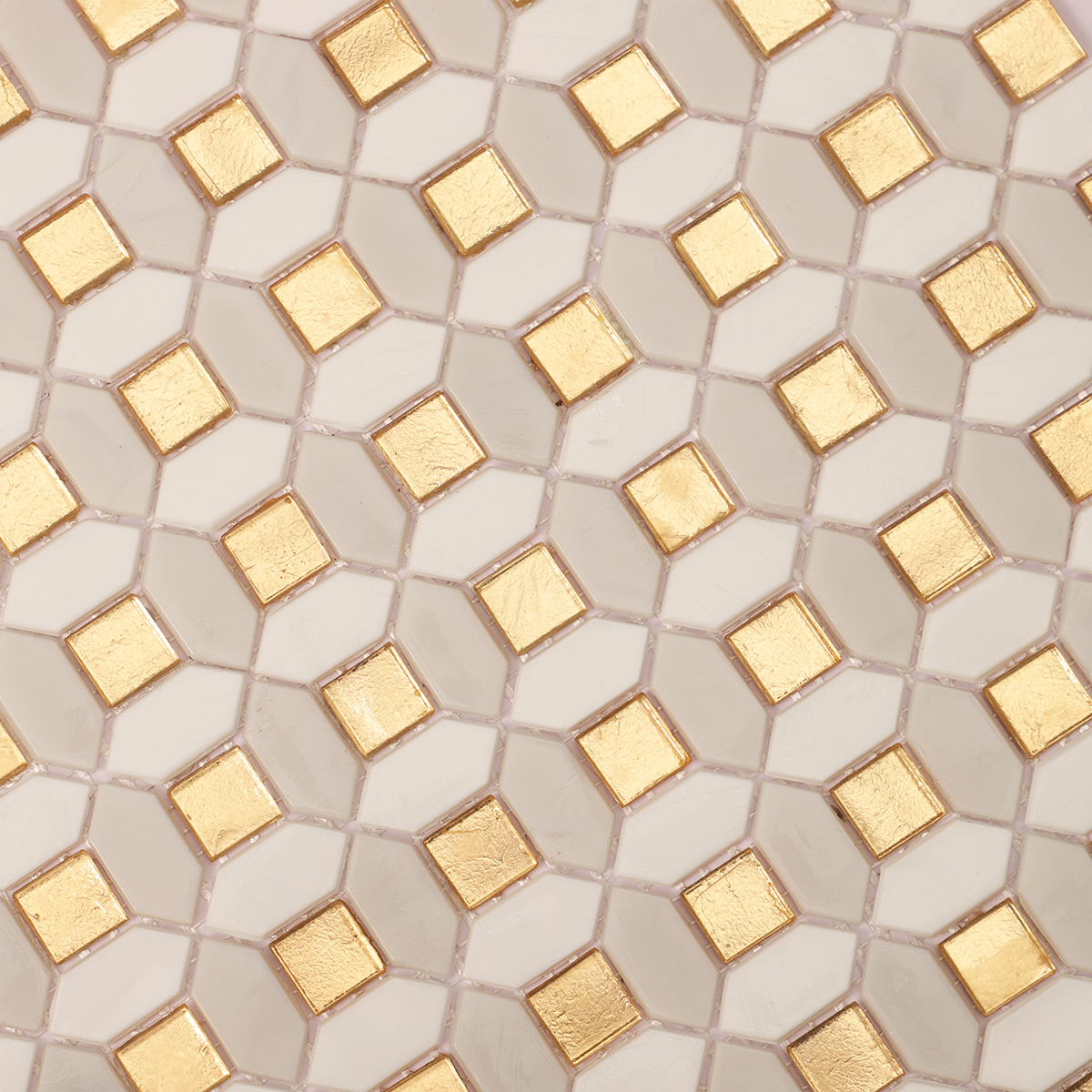 Second close-up of gold and white glass mosaic tiles.