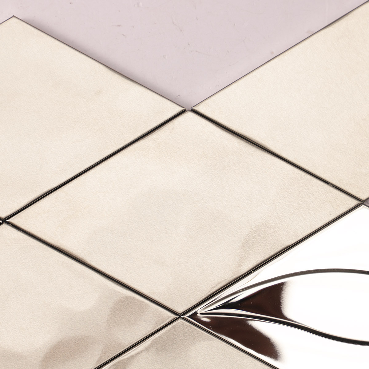 Close-up of particles on mirror silver diamond stainless steel mosaic, matte and glossy mix