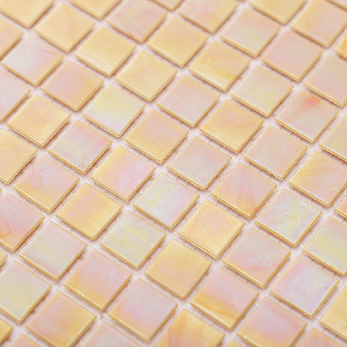 Detailed close-up of pearlescent bright yellow square glass mosaic tiles