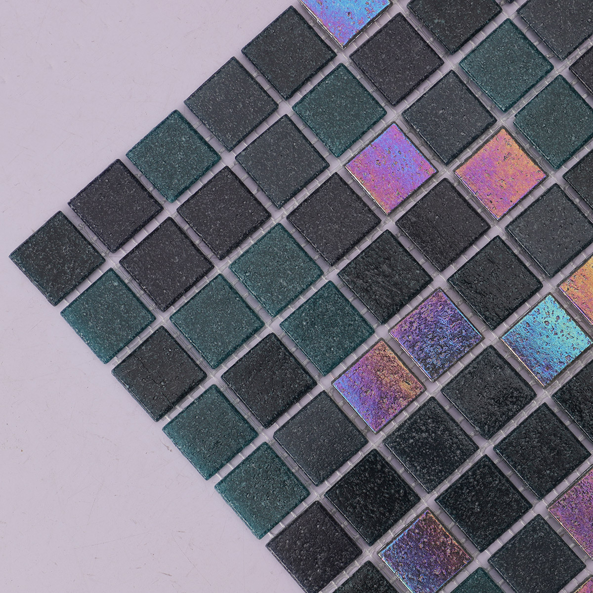 Detailed side close-up of black mix bottle green glass mosaic tile