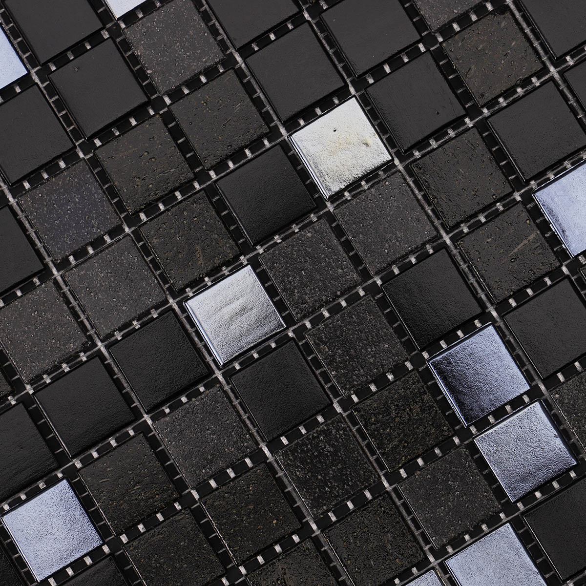 Close-up of black square glass mosaic tiles