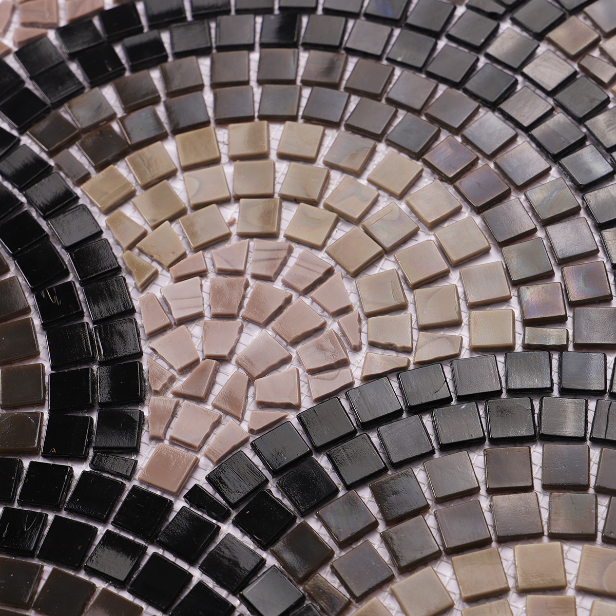 Close-up of hand-cut scale glass mosaic artwork tiles