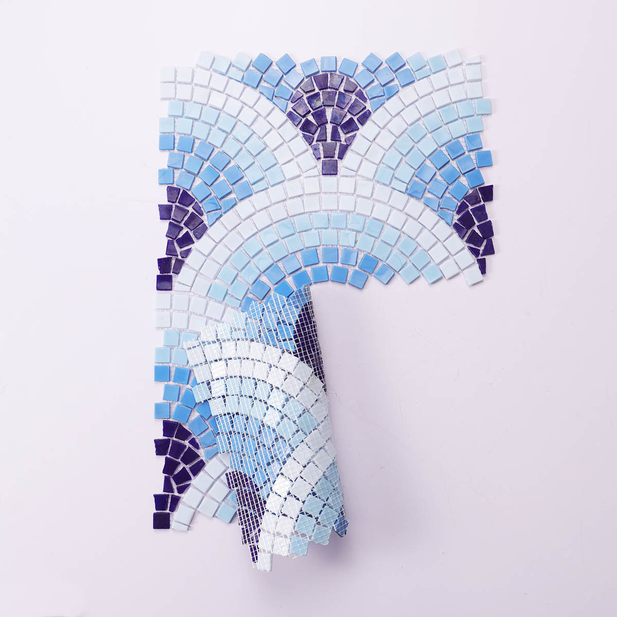 Back side of blue scale glass mosaics with cutting art, folded
