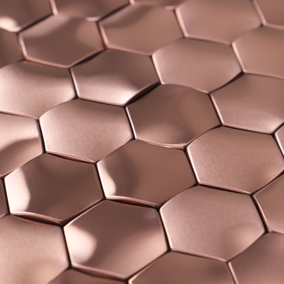 Detailed close-up of rose gold 3D hexagon stainless steel mosaic tiles.