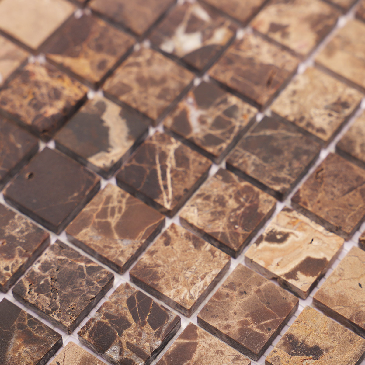 Detailed close-up of dark brown mosaic marble tiles
