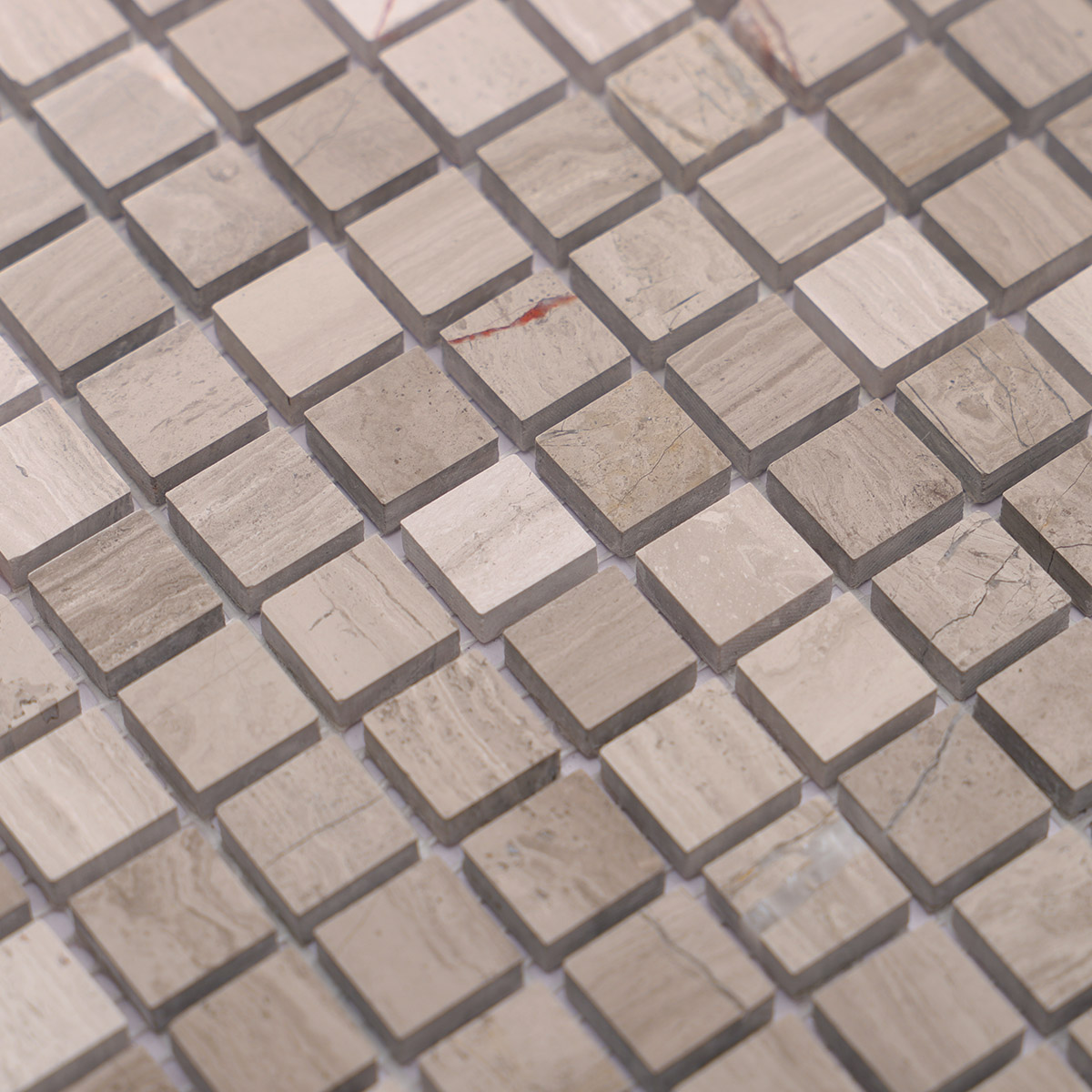 lose-up of Grigio Imperiale square marble mosaic tiles.