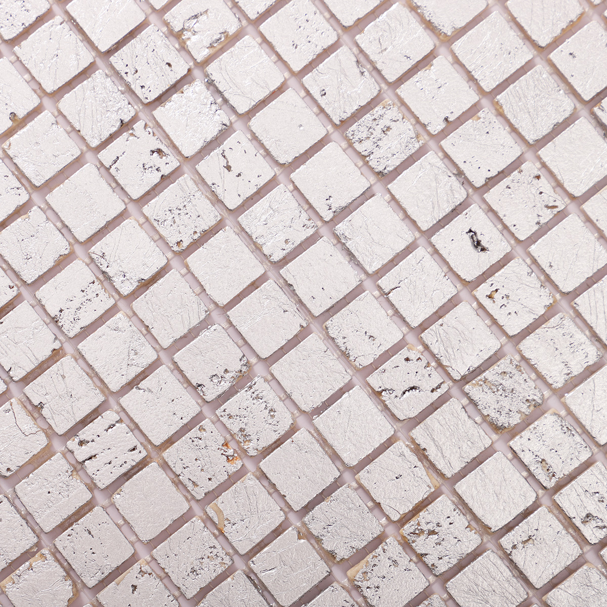 Close-up of silver foil travertine mosaic wall tiles.