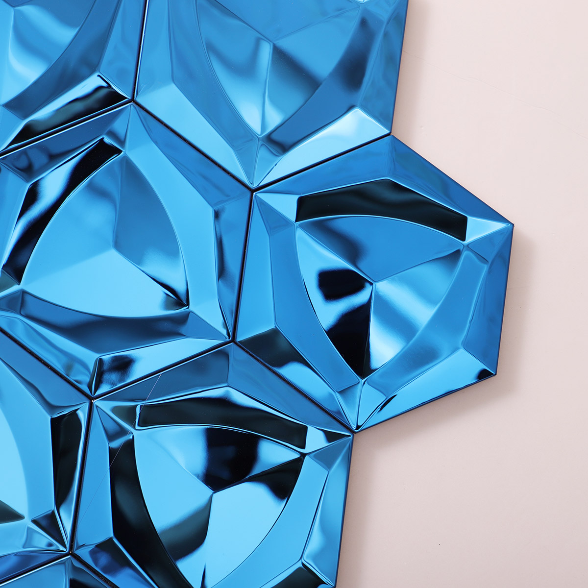 Detailed close-up of 3D blue hexagon stainless steel mosaic tiles.