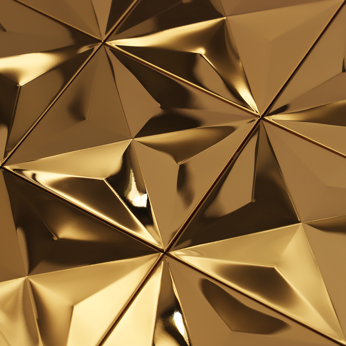 Detailed close-up of 3D gold stainless steel mosaic tiles.