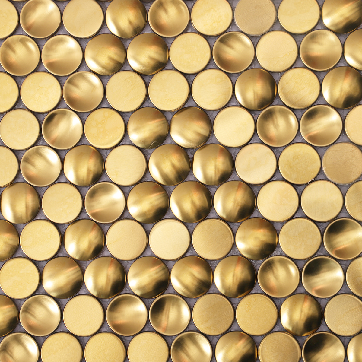 Close-up of penny round gold metal mosaic tile