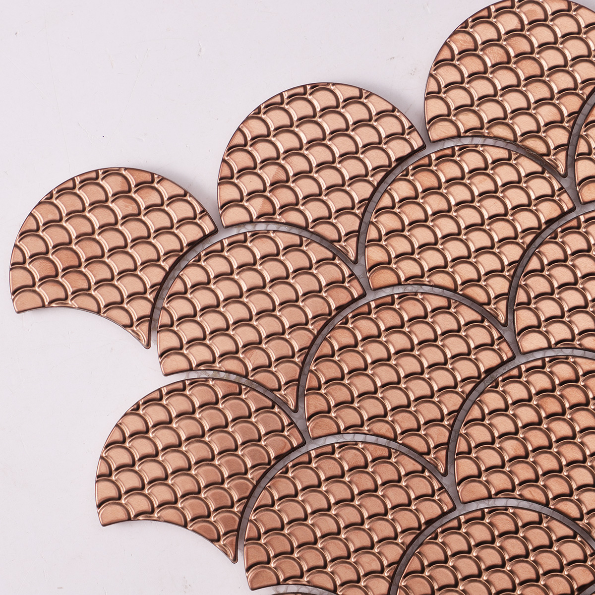 Close-up of rose gold metal scallop mosaic tiles.