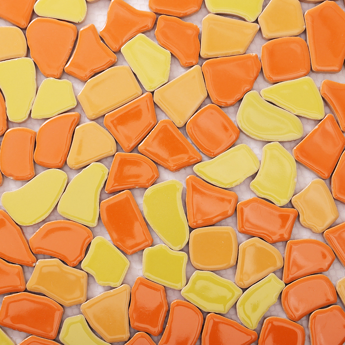 Close-up of glazed broken ceramic mosaic porcelain tile.