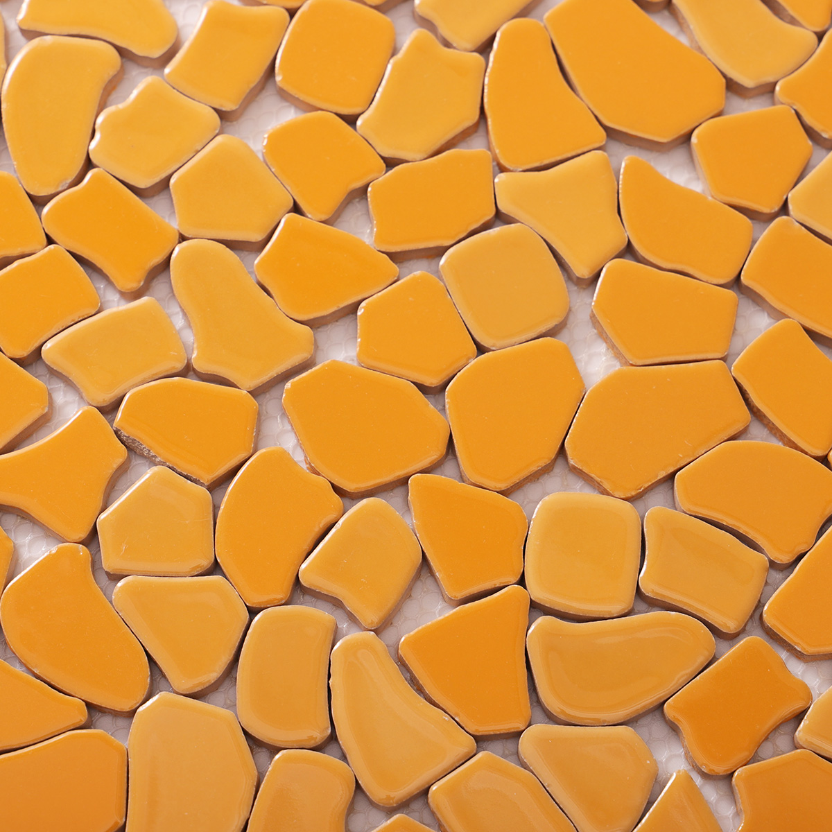 Detailed close-up of cracked ceramic mosaic art tiles.