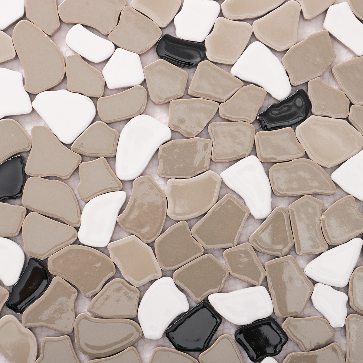 Close-up of glossy grey ceramic cracked mosaic tiles.