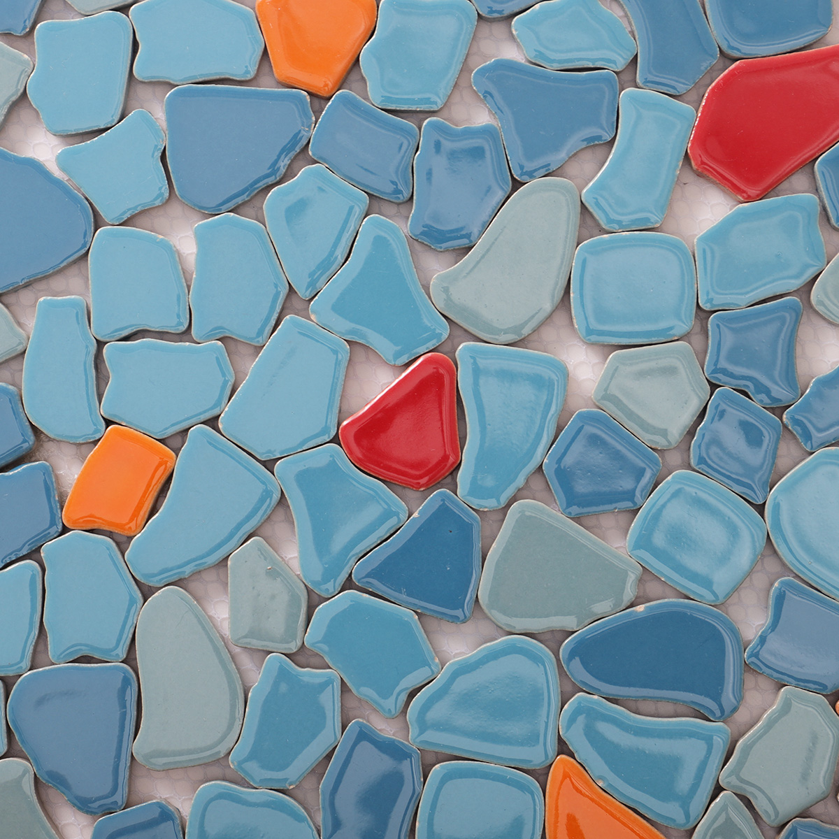 Close-up of irregular ceramic pebble cracked mosaic tiles.