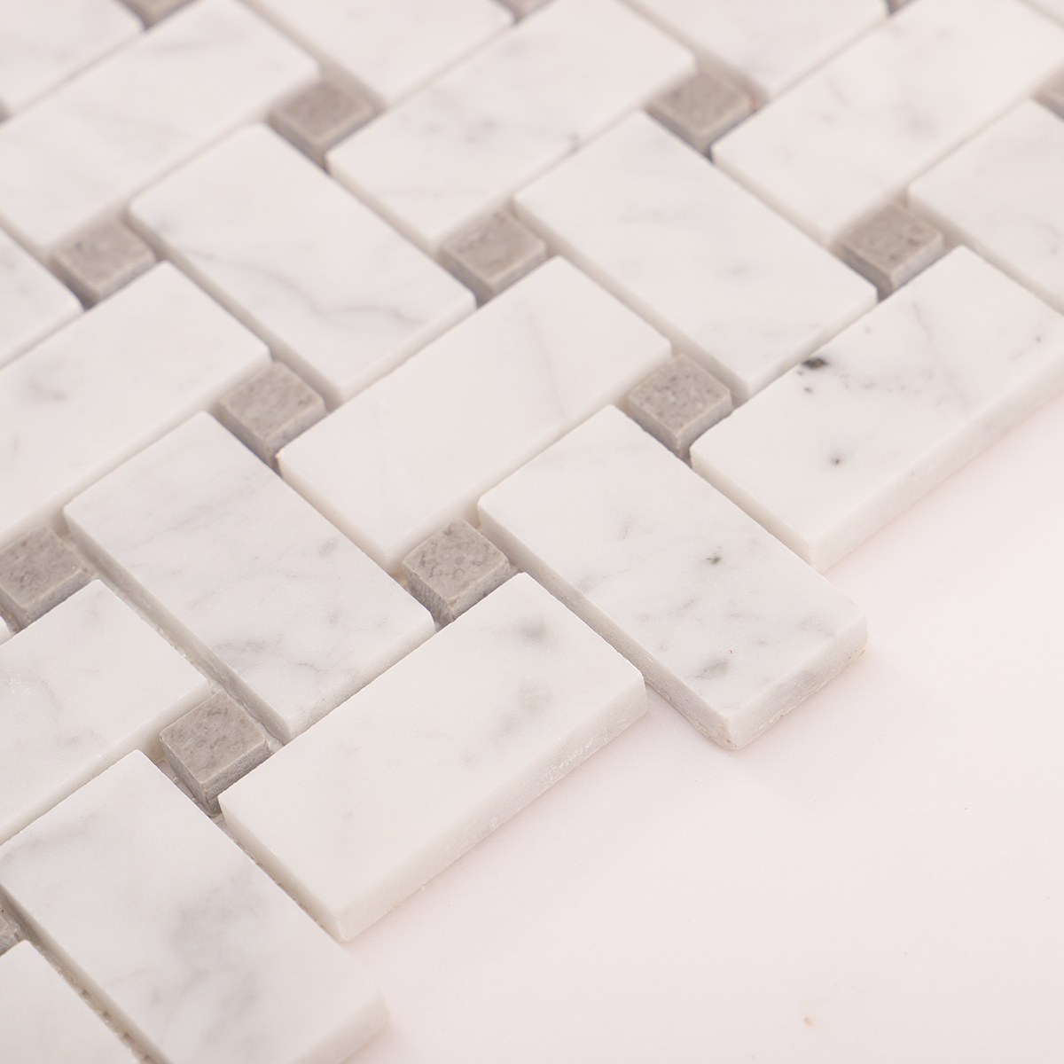 Close-up of Carrara white basketweave marble mosaic tiles