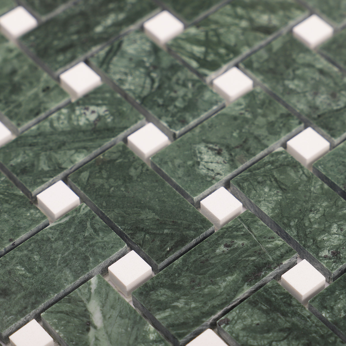 Detailed close-up of Verde green basketweave marble mosaic tiles