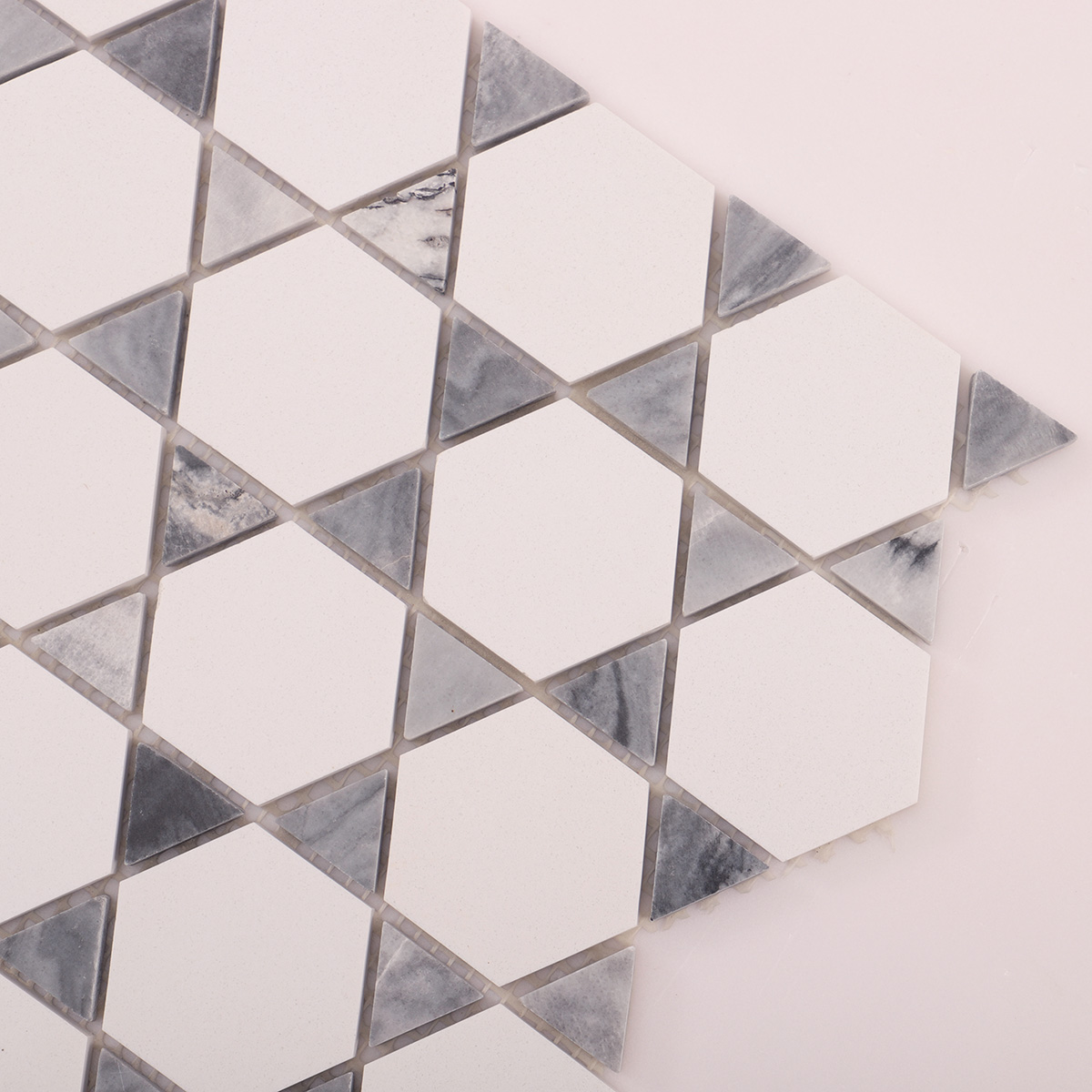 Detailed close-up of hexagon mix triangle marble mosaic tiles