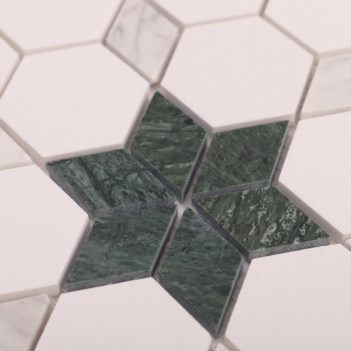 Close-up of green and white floral marble mosaic tiles