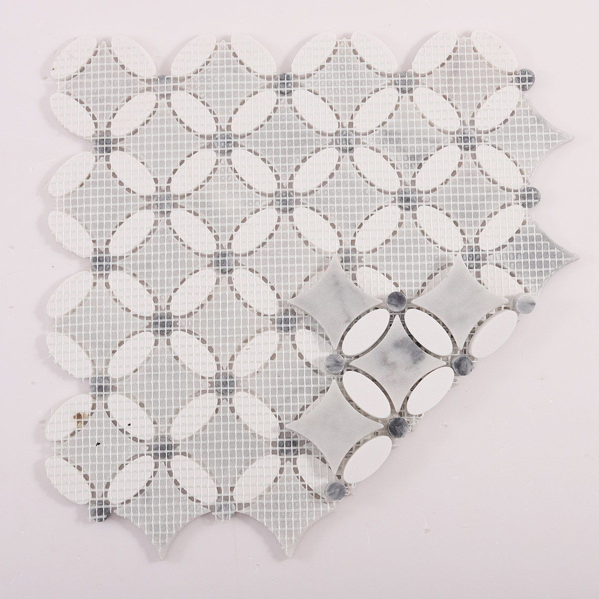 Rear folded view of thassos gray and white floral marble mosaic tiles