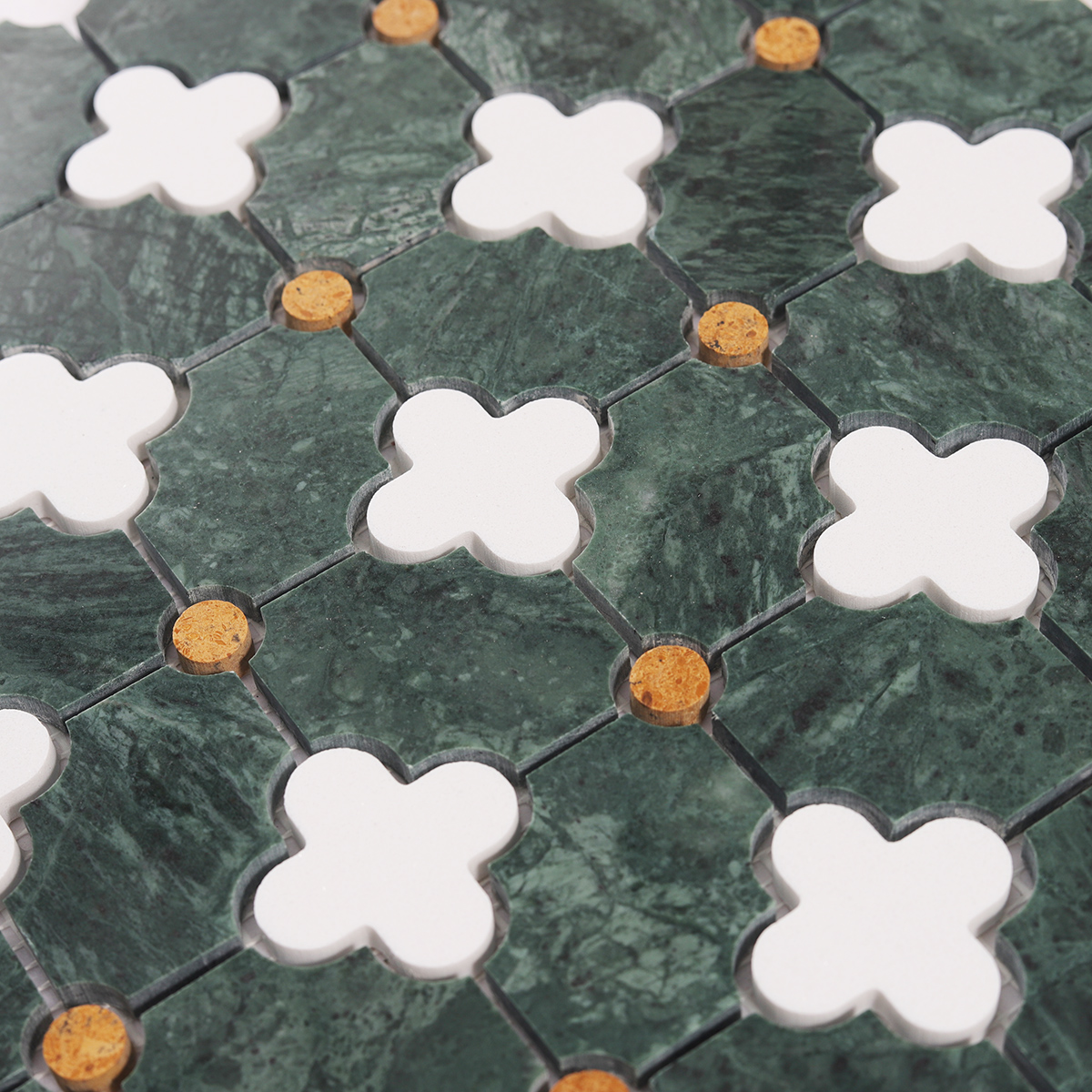 Detailed close-up of green and white floral pattern polished stone mosaic tiles