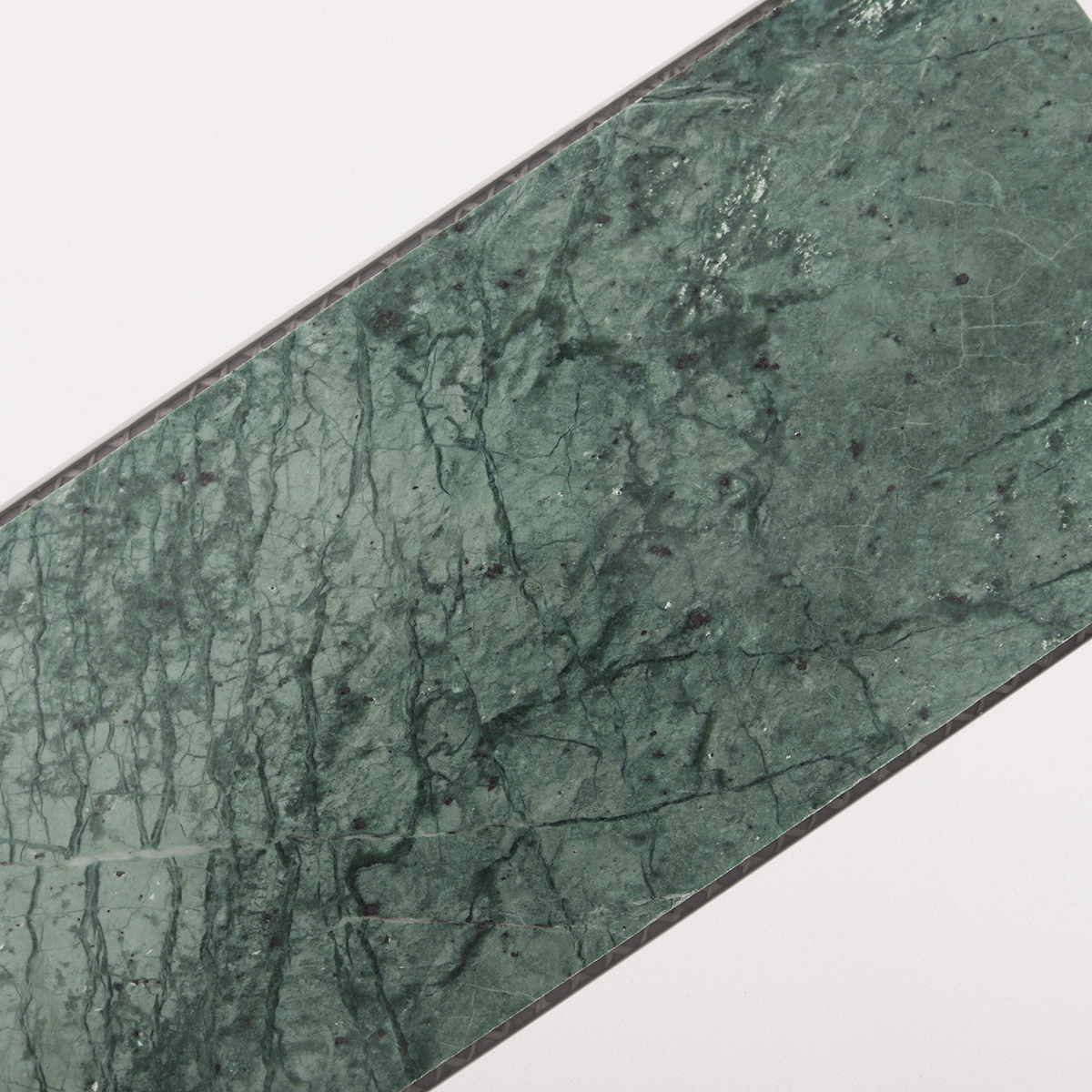 Close-up of big hexagon green and white marble tiles